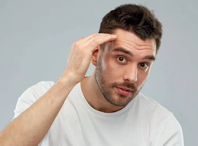 Professional Detan Services for Men in Ashok Nagar, Bangalore for Clear & Even Skin Tone At US Hairline Salon
